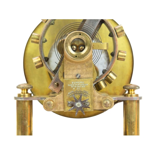 892 - A Eureka electric mantel clock. The 10cm cream enamel dial with Arabic numerals, the battery compart... 