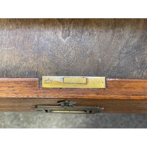 908 - A Victorian campaign type teak pedestal desk. With a raised three-quarter gallery, fitted with nine ... 