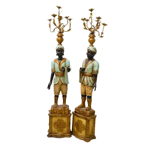 925 - Two Blackamoor type figural floor-standing candelabra. Mid 20th century, carved and painted softwood... 