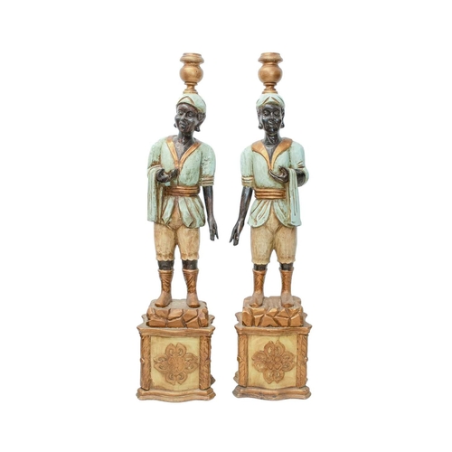 925 - Two Blackamoor type figural floor-standing candelabra. Mid 20th century, carved and painted softwood... 