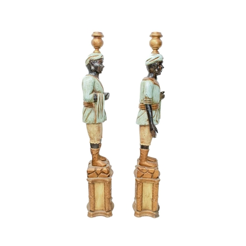 925 - Two Blackamoor type figural floor-standing candelabra. Mid 20th century, carved and painted softwood... 