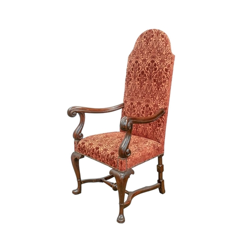 927 - A George I style walnut framed armchair. With an arched back, scroll end arms, and cabriole legs wit... 