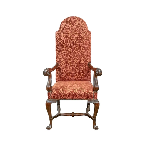 927 - A George I style walnut framed armchair. With an arched back, scroll end arms, and cabriole legs wit... 