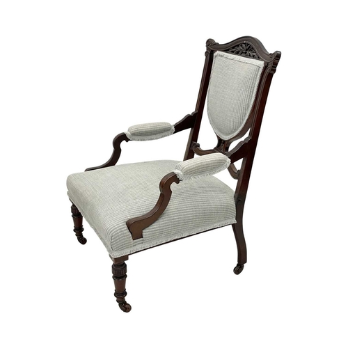 933 - An Edwardian mahogany part salon suite. Comprising two armchairs and two single chairs, with pierced... 