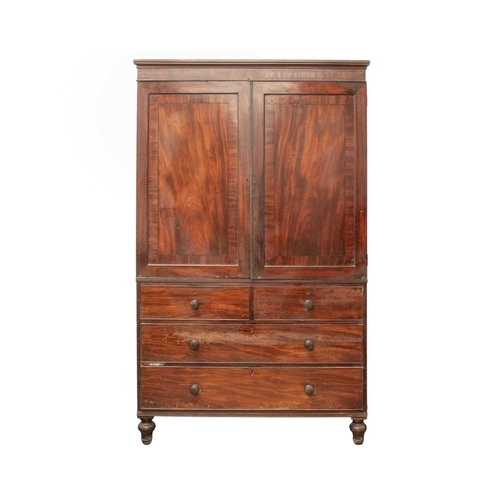 941 - A George IV mahogany and ebony strung linen press, The upper part with two panel doors enclosing sli... 