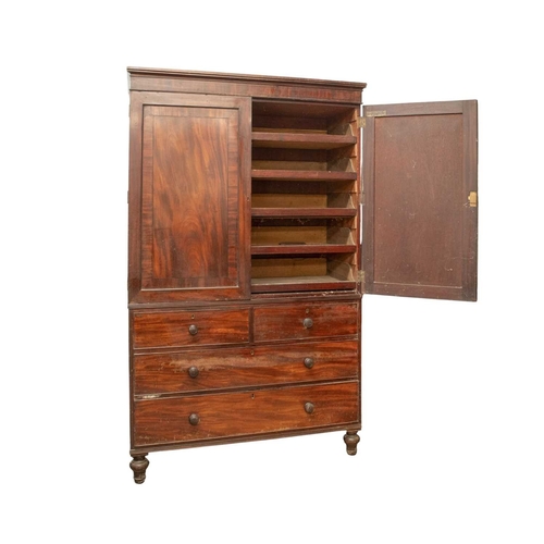 941 - A George IV mahogany and ebony strung linen press, The upper part with two panel doors enclosing sli... 