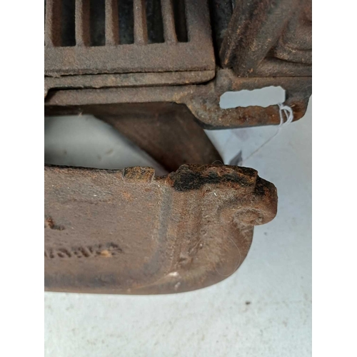 945 - A Falkirk cast iron stove. Of slight proportions, No. 6, height 49cm, width 42cm, depth 31cm.