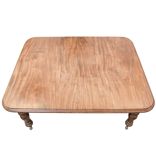 953 - A Victorian mahogany extending dining table. The top with one additional leaf, with rounded corners ... 