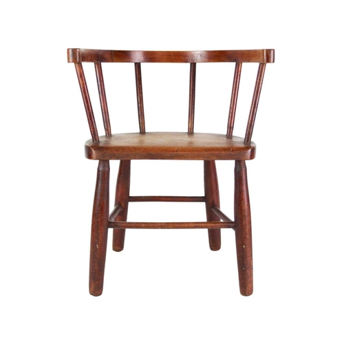957 - A beech and ash child's stick back chair. First quarter 20th century, with a solid seat and turned l... 