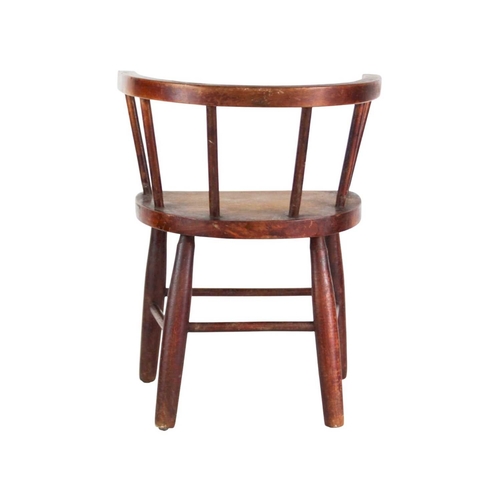 957 - A beech and ash child's stick back chair. First quarter 20th century, with a solid seat and turned l... 