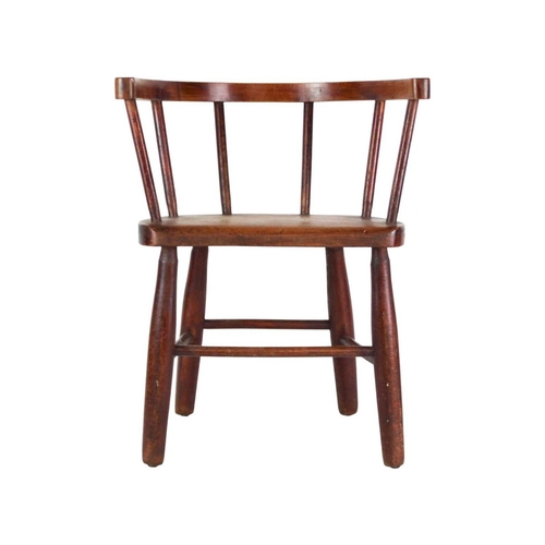 957 - A beech and ash child's stick back chair. First quarter 20th century, with a solid seat and turned l... 