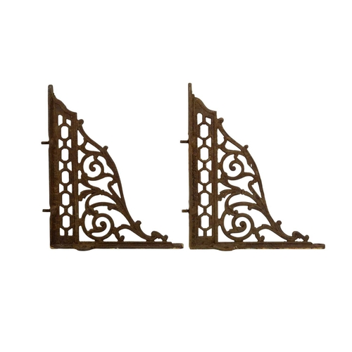 97 - A pair of Victorian cast iron shelf brackets. Height 28cm, depth 35cm.