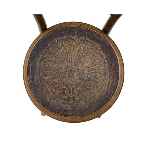 975 - A set of seven bentwood bistro chairs. Thonet style, early 20th century, with double hoop backs and ... 