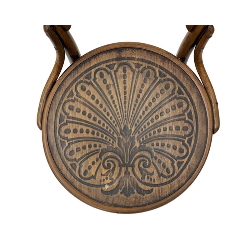 975 - A set of seven bentwood bistro chairs. Thonet style, early 20th century, with double hoop backs and ... 