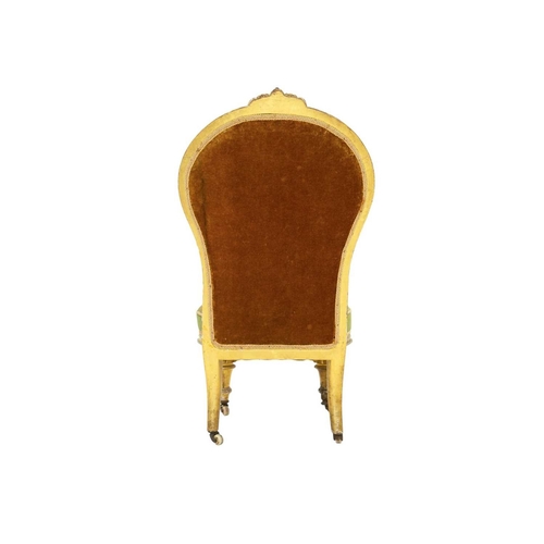 978 - A Victorian giltwood nursing chair. The balloon shape back with carved crest and with woolwork and b... 