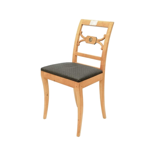 979 - A set of four Biedermeier style dining chairs. The centre rails with burr panels centering a gilt pa... 