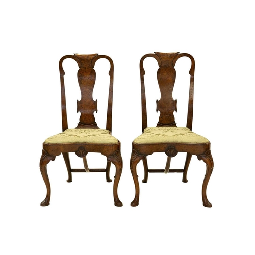 983 - A pair of Queen Anne style walnut chairs. 19th century, the well figured burr veneered backs with pa... 