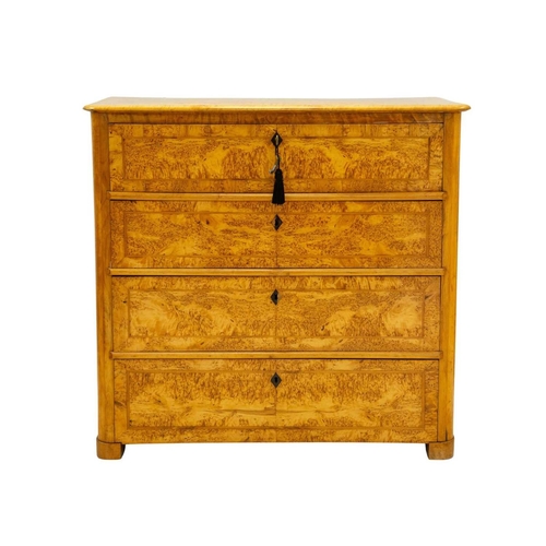 985 - A Biedermeier satin birch secretaire chest. 19th century, the hinged fall fitted a central cupboard,... 