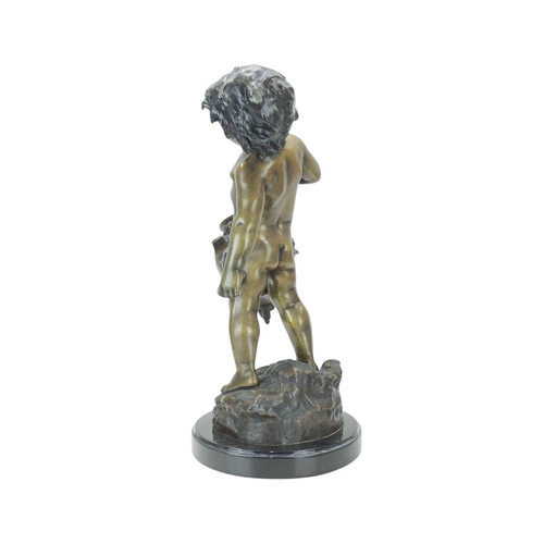 105 - After Auguste MOREAU (1834-1917). A 20th century painted bronze sculpture depicting a young boy carr... 