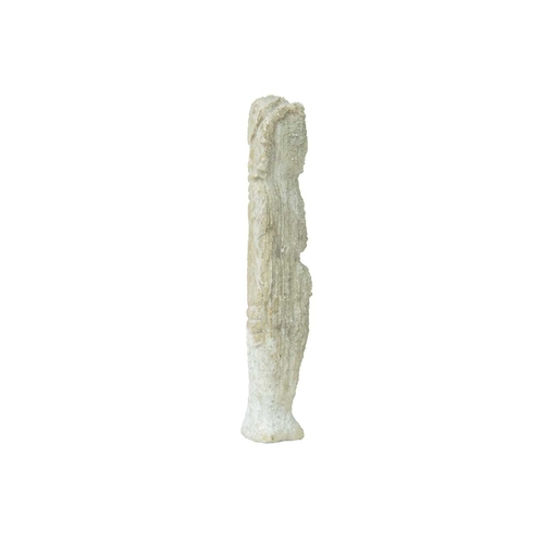 106 - A small carved stone figure of a deity. Possibly limestone, height 15cm.