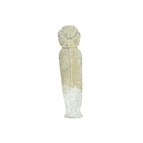 106 - A small carved stone figure of a deity. Possibly limestone, height 15cm.