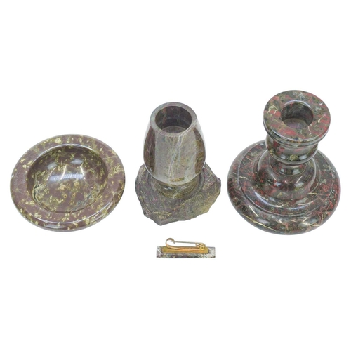 108 - A Cornish serpentine candlestick. Height 9cm, together with a turned serpentine vase raised on rough... 