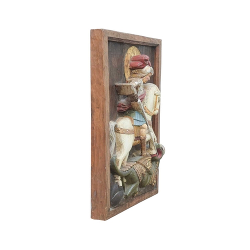 111 - A carved relief panel of St George and the dragon. Early 20th century, Spanish or Italian, with poly... 