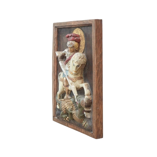 111 - A carved relief panel of St George and the dragon. Early 20th century, Spanish or Italian, with poly... 