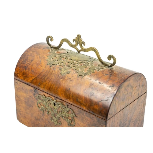 119 - A Victorian figured walnut dome top tea caddy. With a shaped cut brass handle and mounts, lacks inte... 