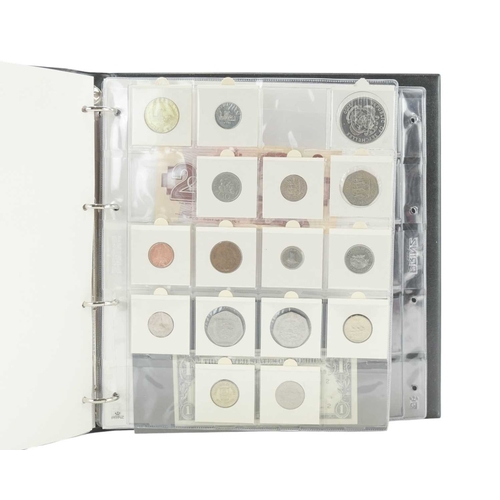 208 - Coin Collection in Album. Lot includes a USA 1992 silver dollar and a 1928 Peace Dollar, together wi... 