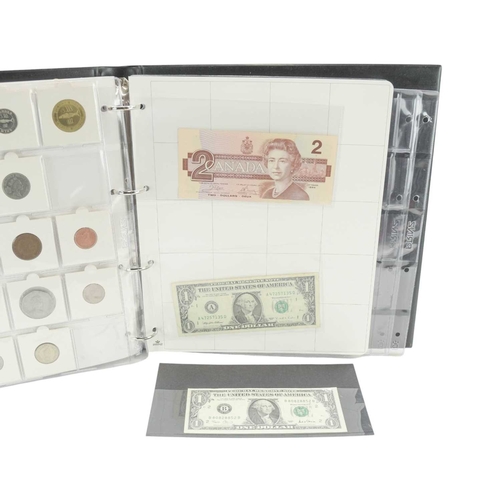 208 - Coin Collection in Album. Lot includes a USA 1992 silver dollar and a 1928 Peace Dollar, together wi... 