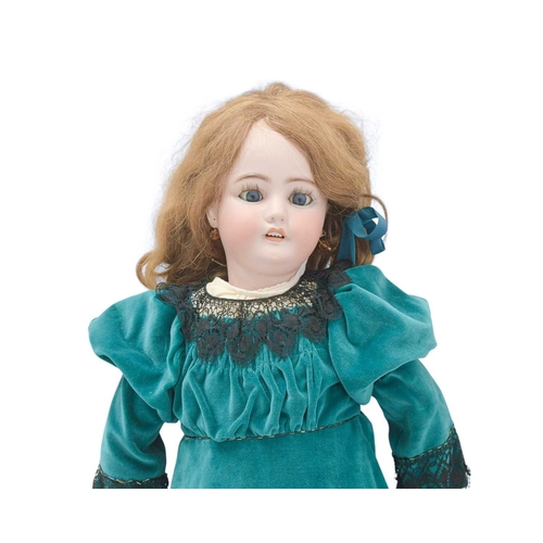 216 - A Simon & Halbig doll, early 20th century. With bisque head, auburn wig, painted eyebrows and eyelas... 