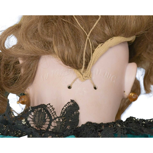 216 - A Simon & Halbig doll, early 20th century. With bisque head, auburn wig, painted eyebrows and eyelas... 