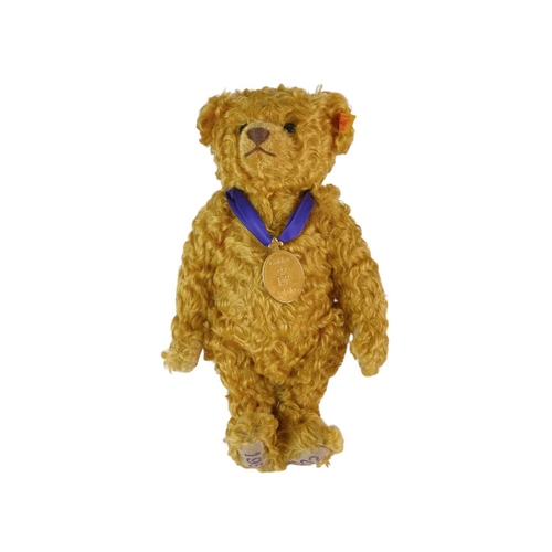 218 - A Steiff 2002 commemorative mohair teddy bear. Made exclusively for Danbury Mint, with a purple ribb... 