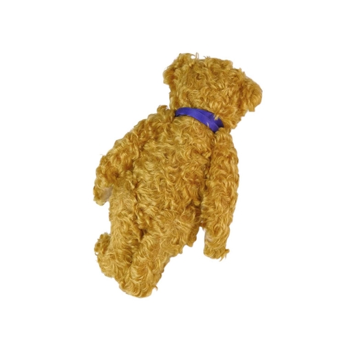 218 - A Steiff 2002 commemorative mohair teddy bear. Made exclusively for Danbury Mint, with a purple ribb... 