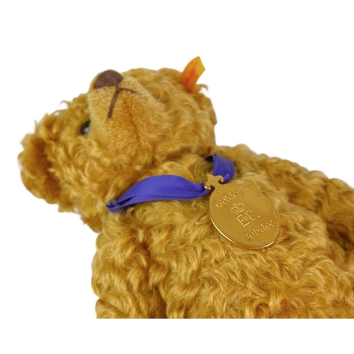 218 - A Steiff 2002 commemorative mohair teddy bear. Made exclusively for Danbury Mint, with a purple ribb... 