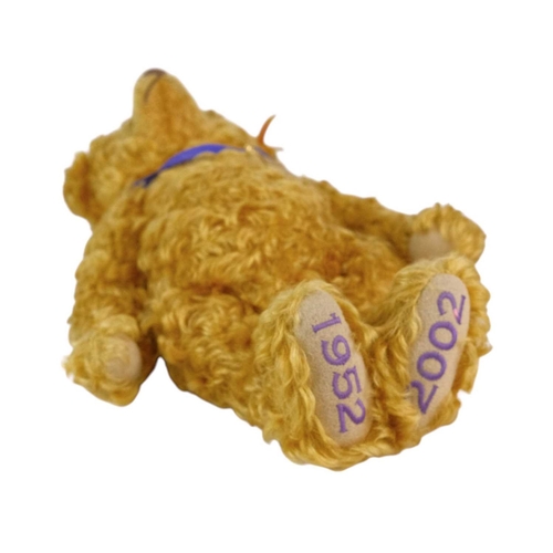 218 - A Steiff 2002 commemorative mohair teddy bear. Made exclusively for Danbury Mint, with a purple ribb... 
