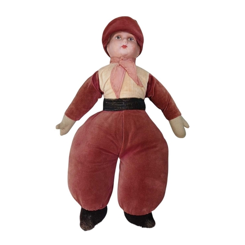 220 - A large vintage Dutch boy doll. Cloth doll with a painted pressed card head, velvet clothing and moh... 