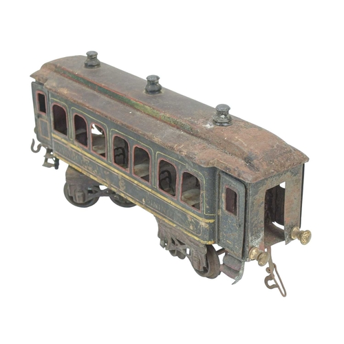 252 - A Bing gauge 1 tinplate dining car. With six tables and six chairs, length 36cm, distressed, and wit... 