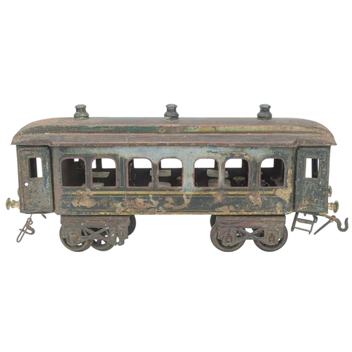 252 - A Bing gauge 1 tinplate dining car. With six tables and six chairs, length 36cm, distressed, and wit... 