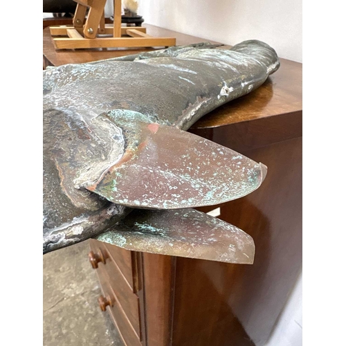 26 - A copper weathervane. modelled as a hollow fox above the compass points, length 82cm. Ex Gwel An Mor... 