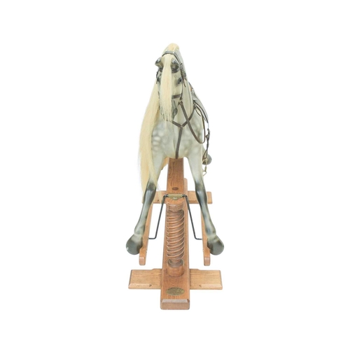 264 - A hand-carved rocking horse by Geoff Martin of Horsecraft, Redruth. Dapple grey, with horsehair mane... 
