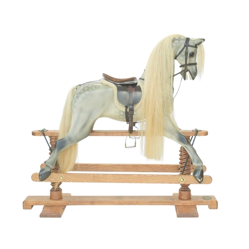 264 - A hand-carved rocking horse by Geoff Martin of Horsecraft, Redruth. Dapple grey, with horsehair mane... 