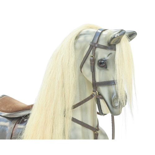 264 - A hand-carved rocking horse by Geoff Martin of Horsecraft, Redruth. Dapple grey, with horsehair mane... 