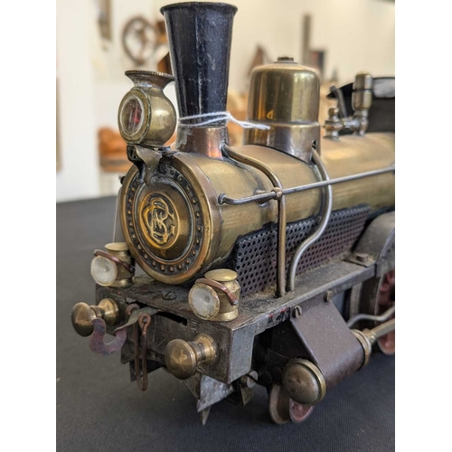 268 - A Bing Gauge 1 live steam 2-2-0 locomotive. Circa 1910, with a brass boiler and traces of red lined ... 