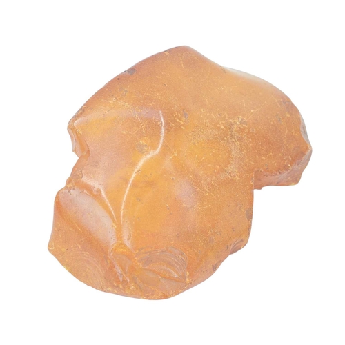 28 - An unworked amber boulder. Height 6cm, width 18cm, depth 12cm, 585g.