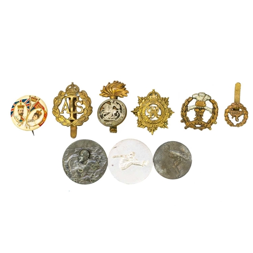 286 - Queen Mary Gift Tin containing various cap badges and medallions. Lot includes a good 1911 Belgium A... 