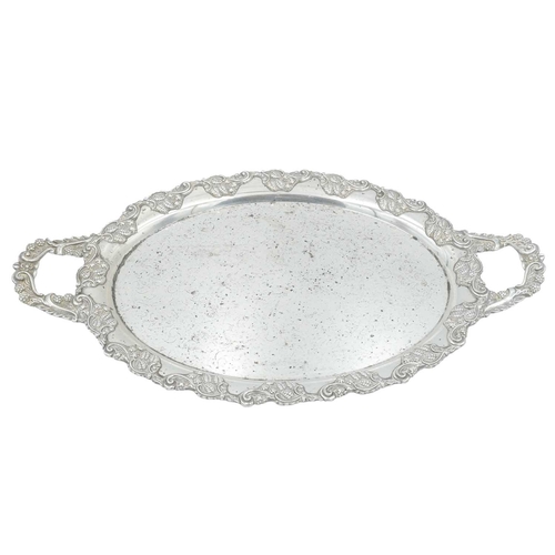 297 - A modern silver coaster. Diameter 12.5cm, with a presentation inscription, together with a silver pl... 