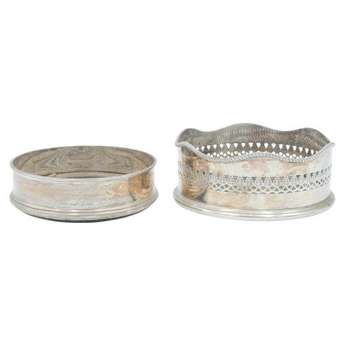 297 - A modern silver coaster. Diameter 12.5cm, with a presentation inscription, together with a silver pl... 
