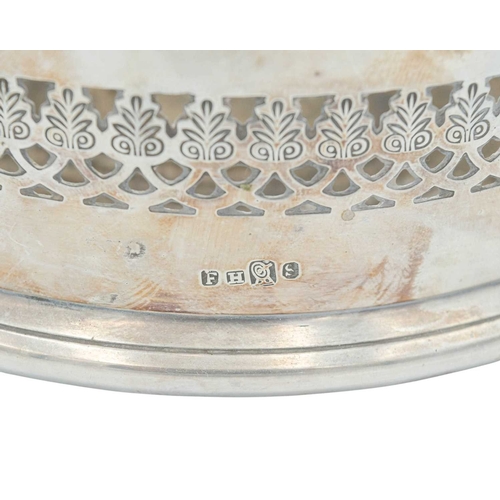 297 - A modern silver coaster. Diameter 12.5cm, with a presentation inscription, together with a silver pl... 
